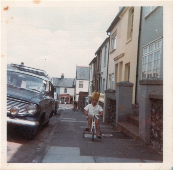 Photo:LAWES AVENUE LOOKING DOWN - 1975 (Clive Stanyard with a bucket on his head?) "HANDY STORES IN THE BACKGROUND"