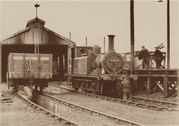 Photo:Terrier 32670 being coaled outside the Newhaven shed - C1960