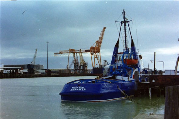 Photo:At her home berth. Note the redundant cranes on the East Quay and the stern of the Exxtor 1 a freight ro-ro ferry that served the route for a few years.