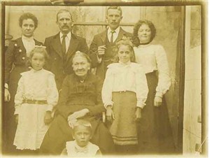 Photo:William, Elizabeth and family, back garden of 4 Lewes Road, approx 1903. Starting from top Left, Elizabeth, William, William James(son), Mabel(dau), Pansie(dau), Adelaide(Wills Mum),Renie(dau), Jack(son)