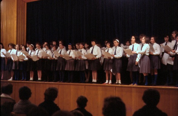 Photo:The choir on stage in the main hall.