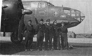 Photo:Jacques far right with his crew in front of their plane