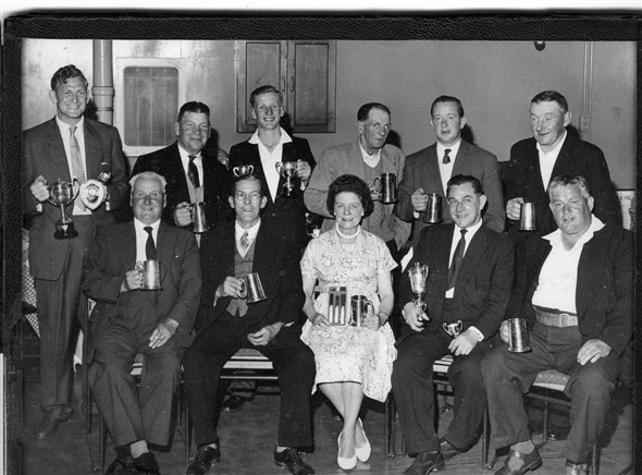 Photo:Darts trophy presentation at The Crown, Newhaven.  Cyril Walton (my father-in-law) is in the front, second from right. Who are the others?
