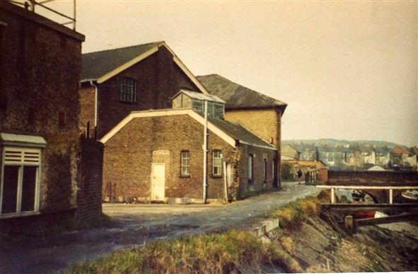 Photo:The back entrance for the Coop grocery and  butchers shop. The bridge to the right was the replacement for the toll bridge, built when the cutting and the North Quay were constucted, creating  Denton Island.